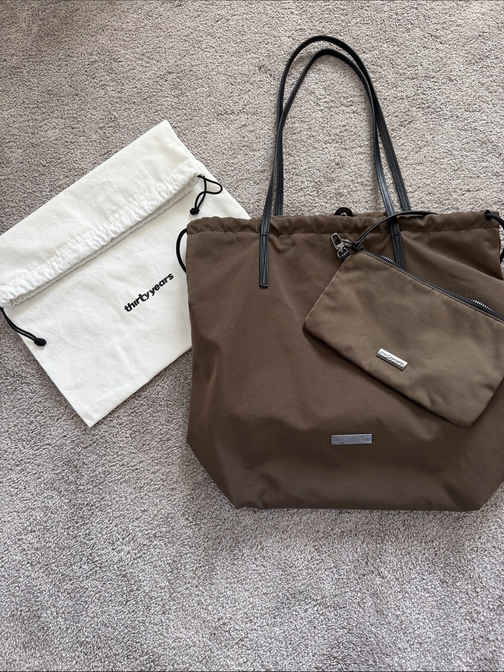 Thirty years brand brown shoulder bag.